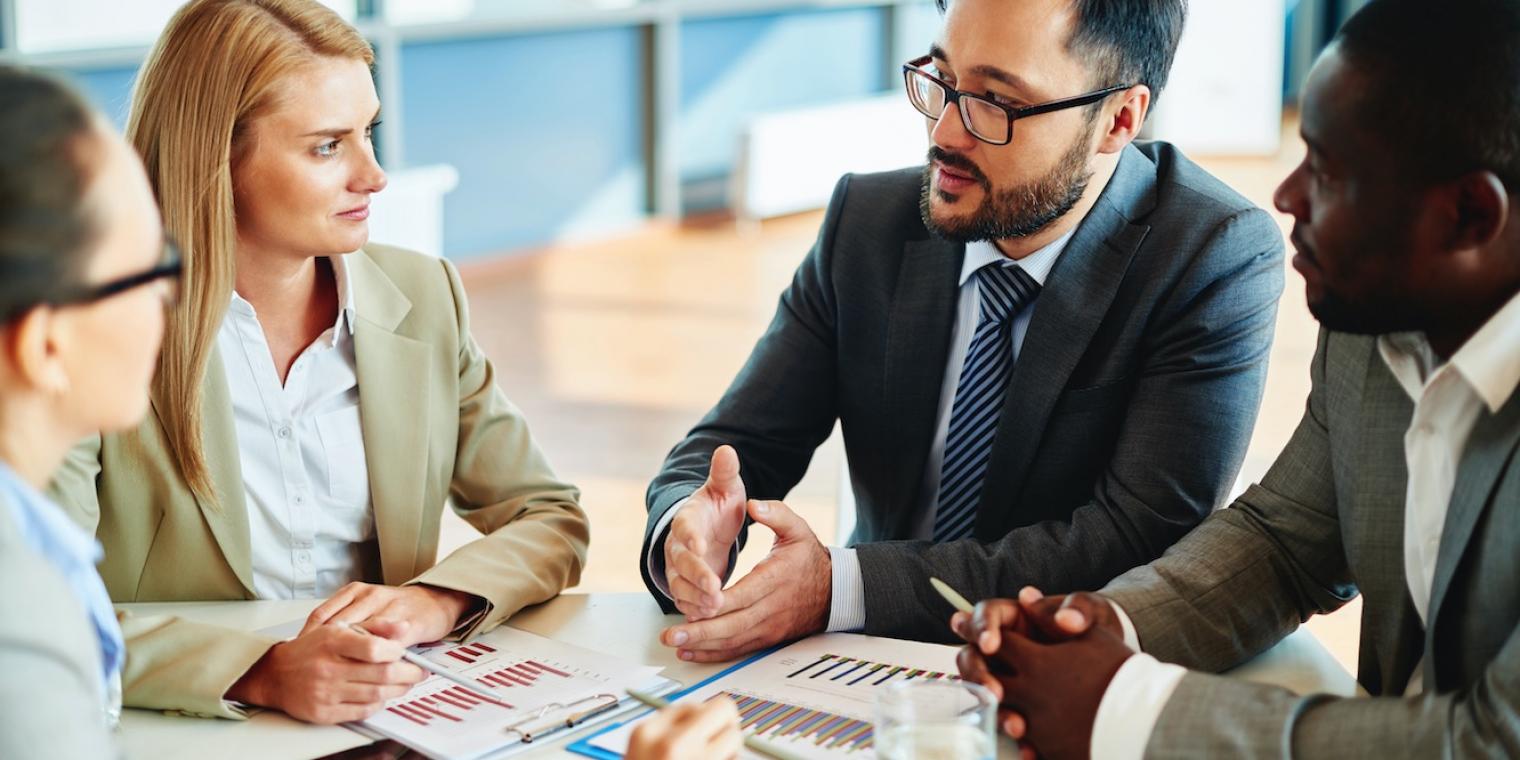 People sitting at a table for a business meeting